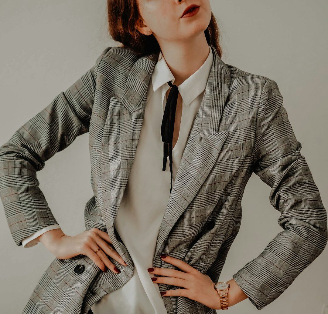 Studio portrait of a Belgian businesswoman with short blonde hair smiling